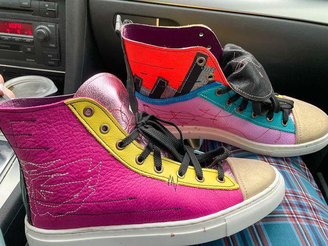Closeup of my shoes on my lap in the car.